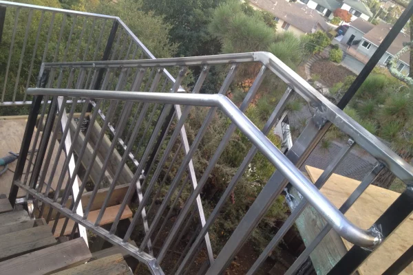 Baly Engineered Dec in San Mate During construction Railing installation put After Fabricating guard rails scaled 600x400